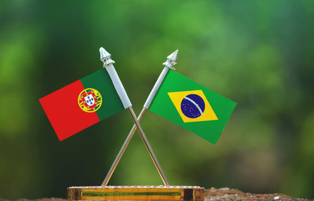 Brazil and Portugal small flags with blur green background