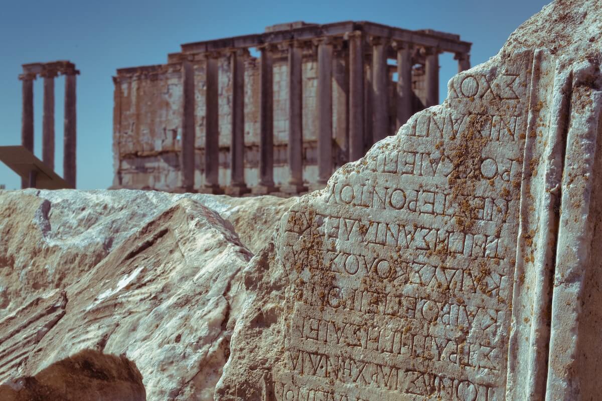 ancient greek inscription amid temple ruins