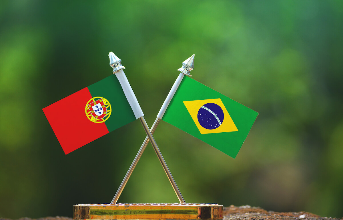 Brazil and Portugal small flags with blur green background