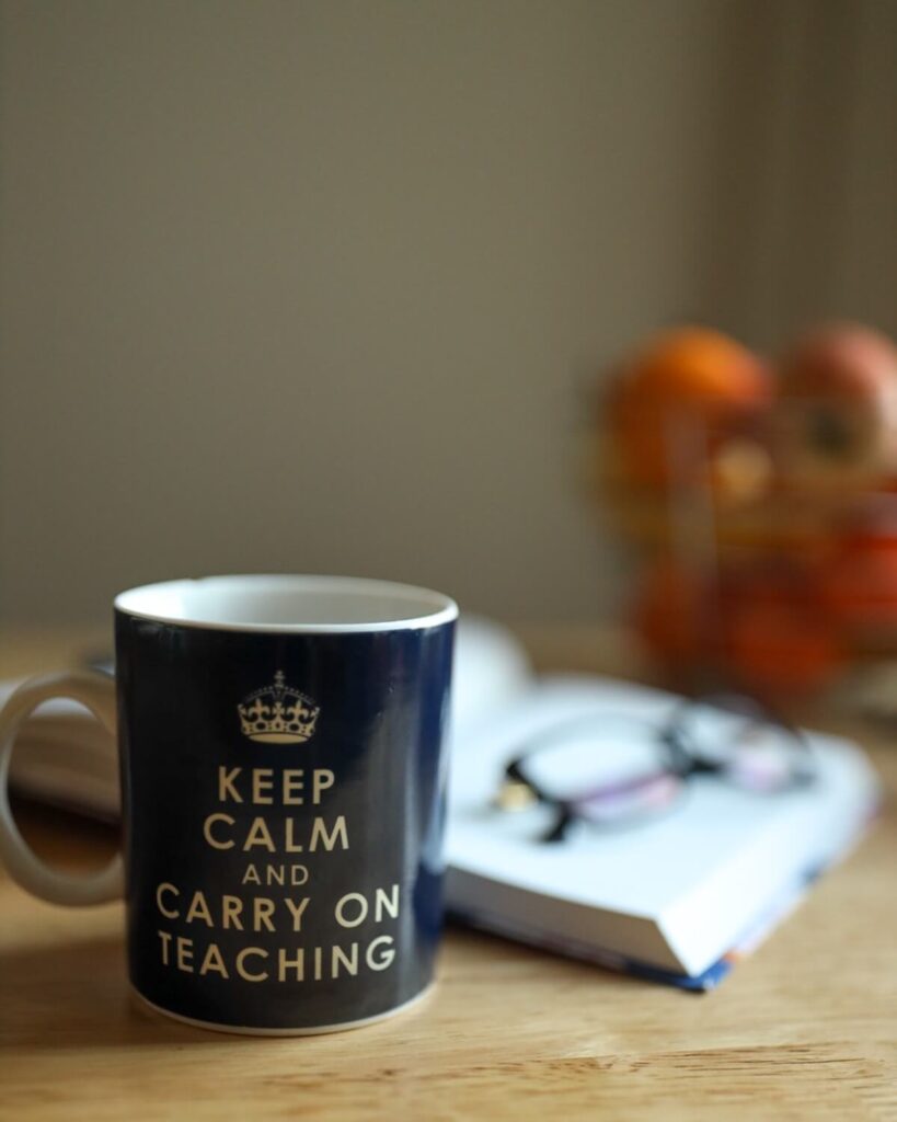 carry on teaching mug on desk