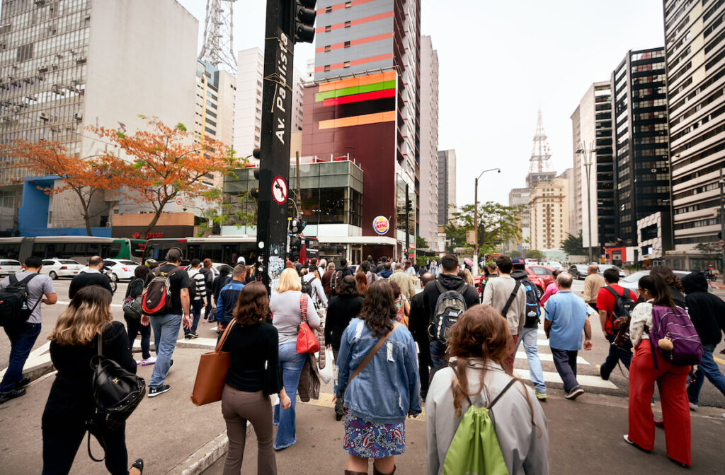 crowd crossing paulista avenue sao paulo
