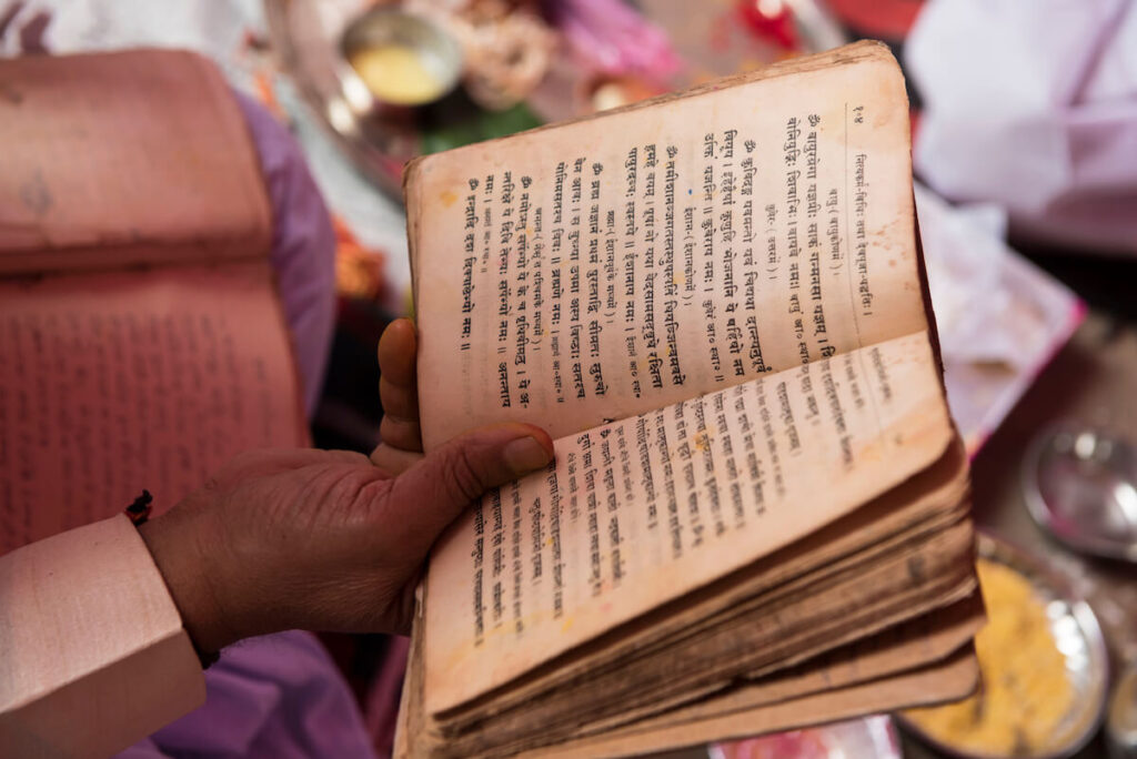 hindu priest reading sanskrit text