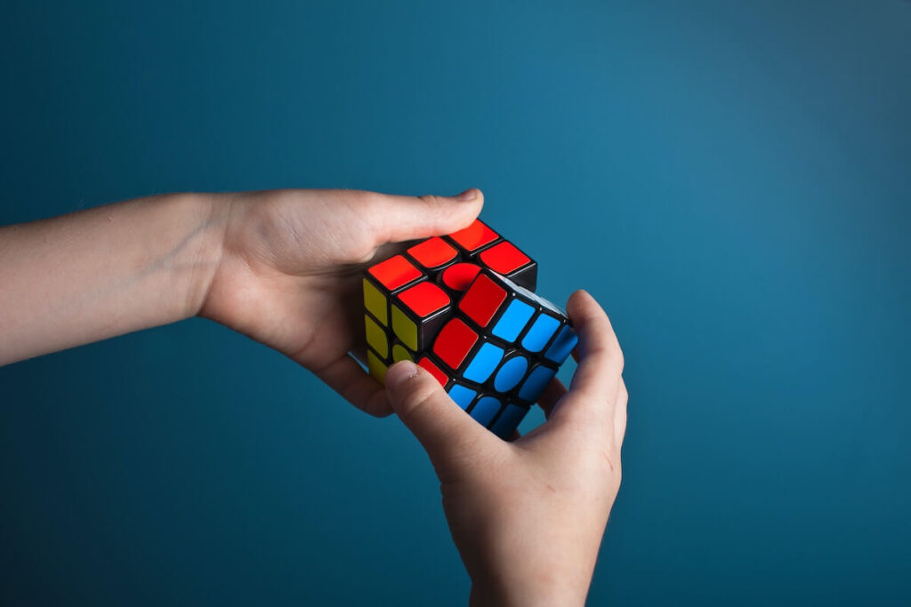 kid solving rubiks cube