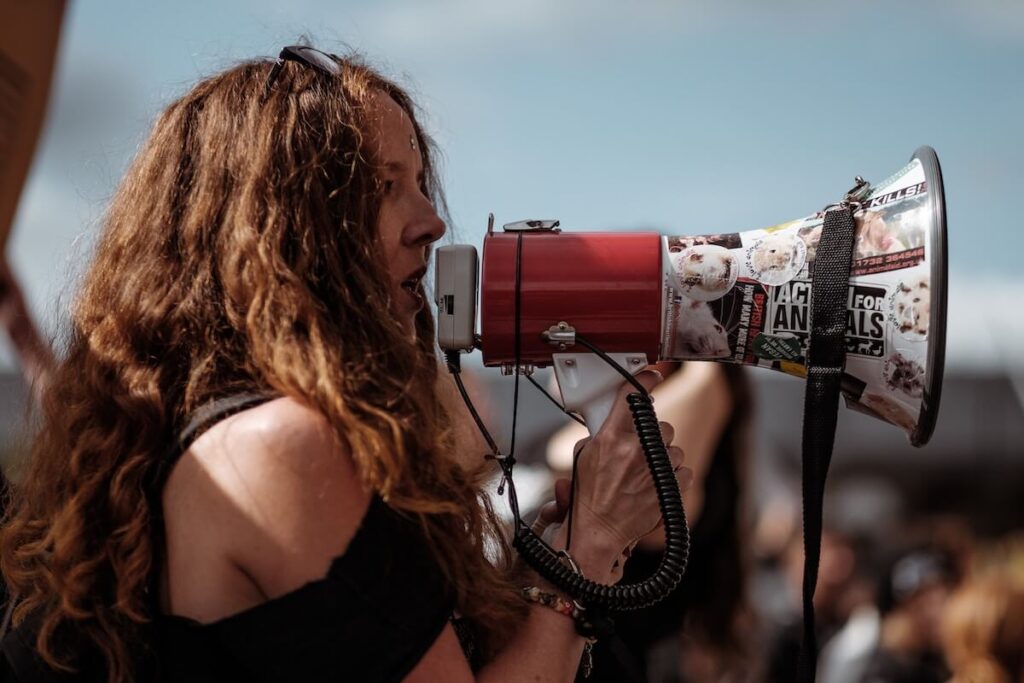 woman speaks into megaphone