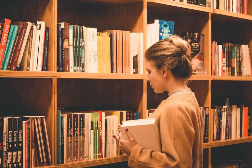 woman browsing library shelves