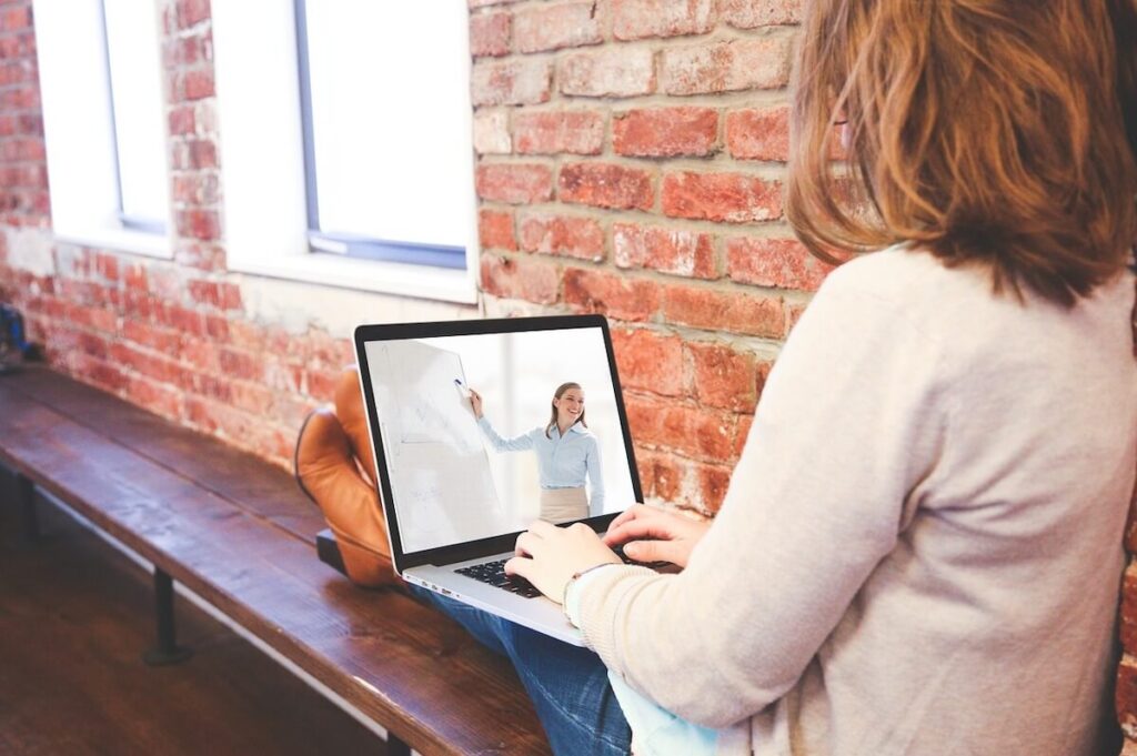 woman taking an online course via laptop