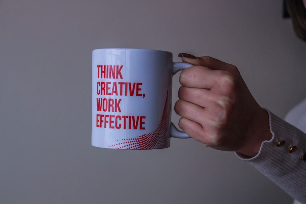 woman holding think creative work effective mug