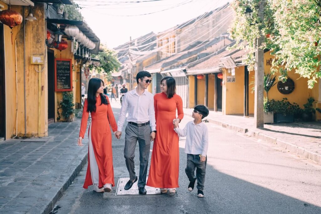 family of four walking down street