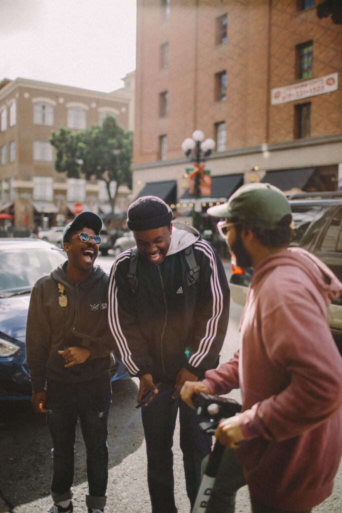 male friends laughing on street