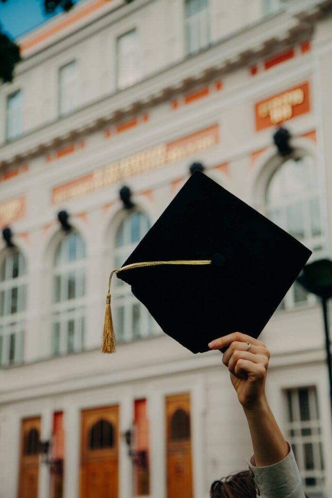 woman holding graduation cap