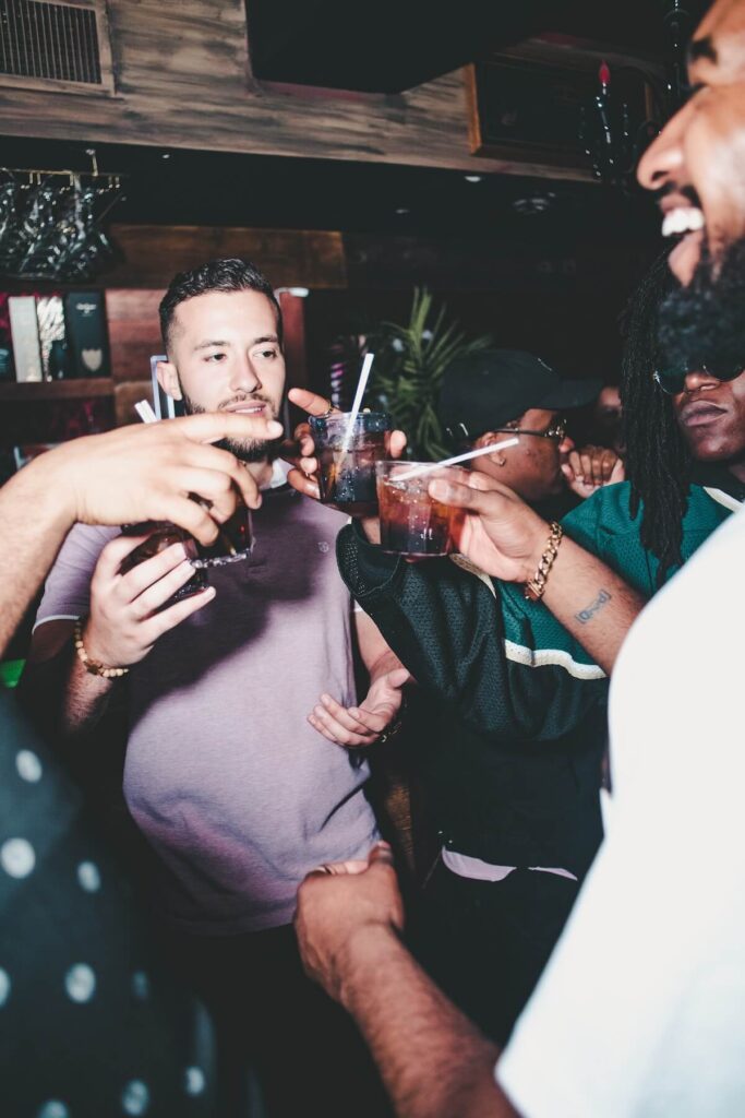 group of men raising toast