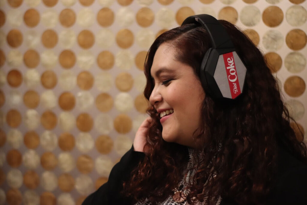 woman smiling with headphones on