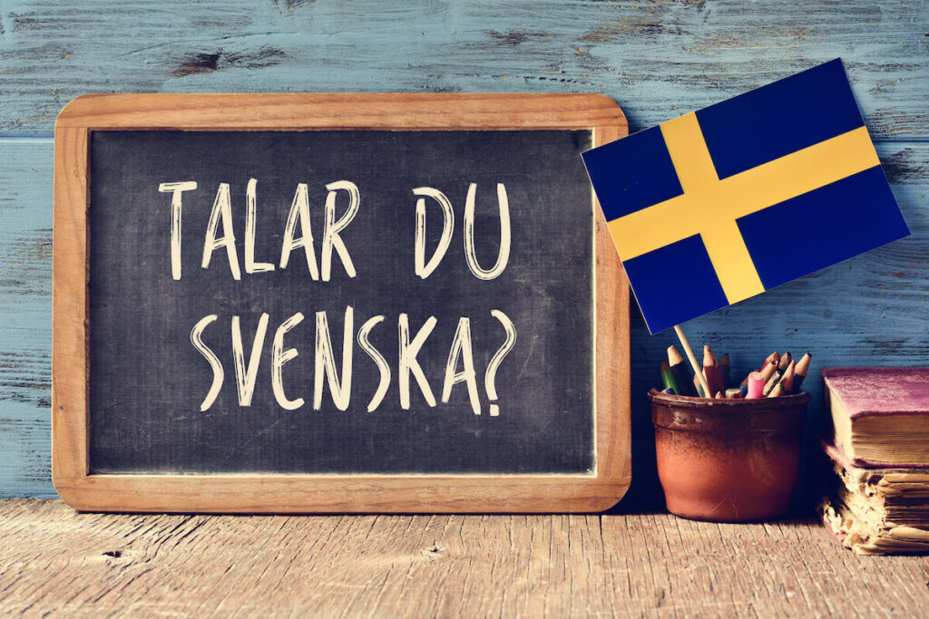 a chalkboard with the question talar du svenska?, or “do you speak Swedish?” written in Swedish