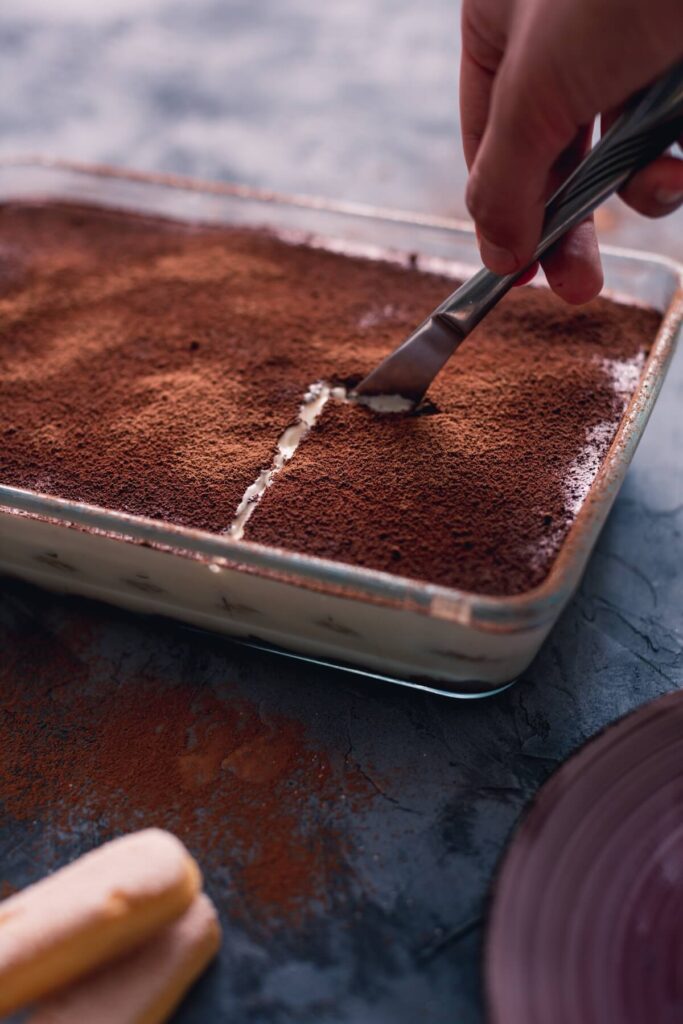 person serving tiramisu