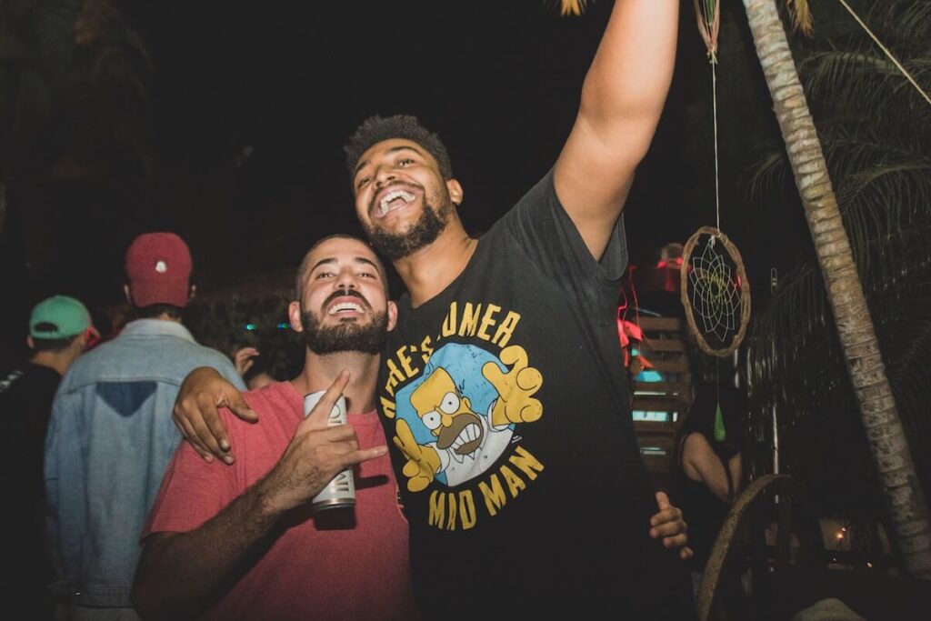 two brazilian male friends at party