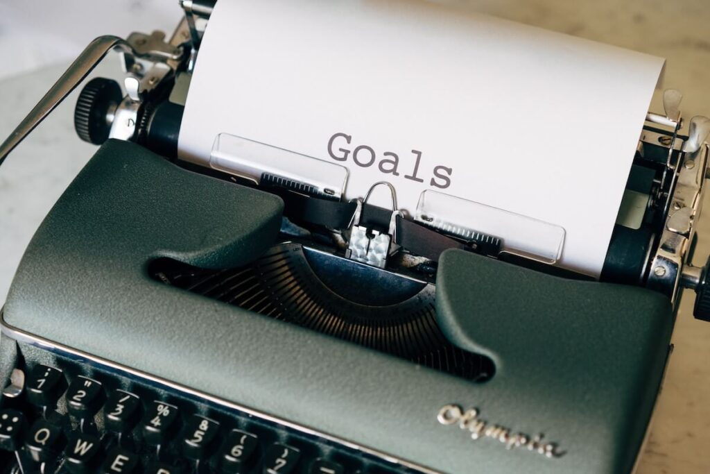 "goals" written on paper on typewriter