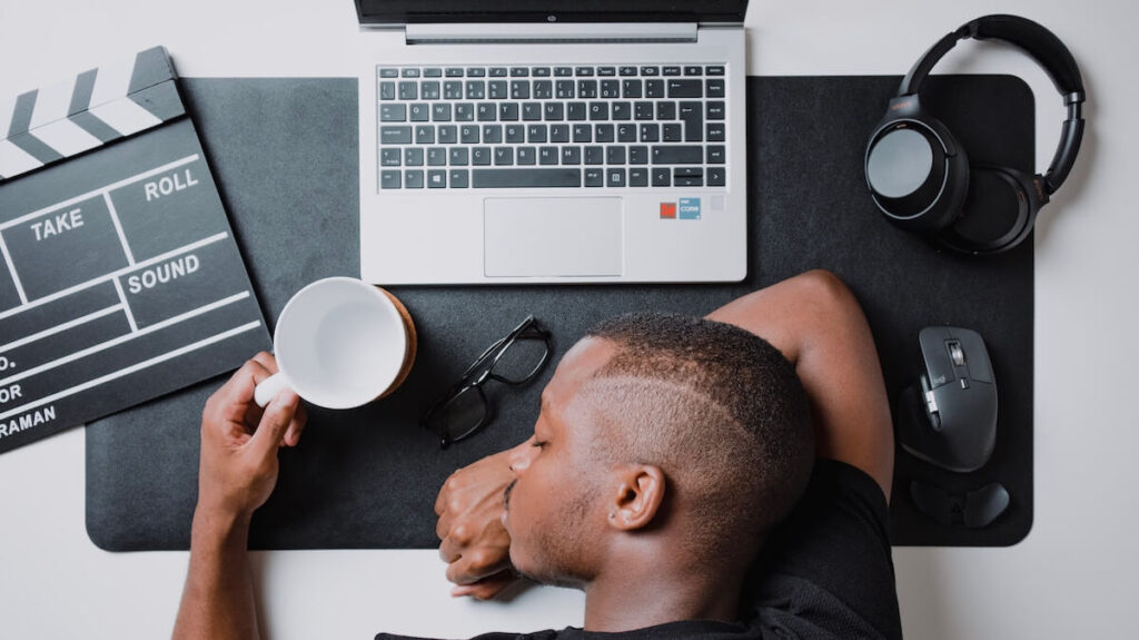 man napping on desk