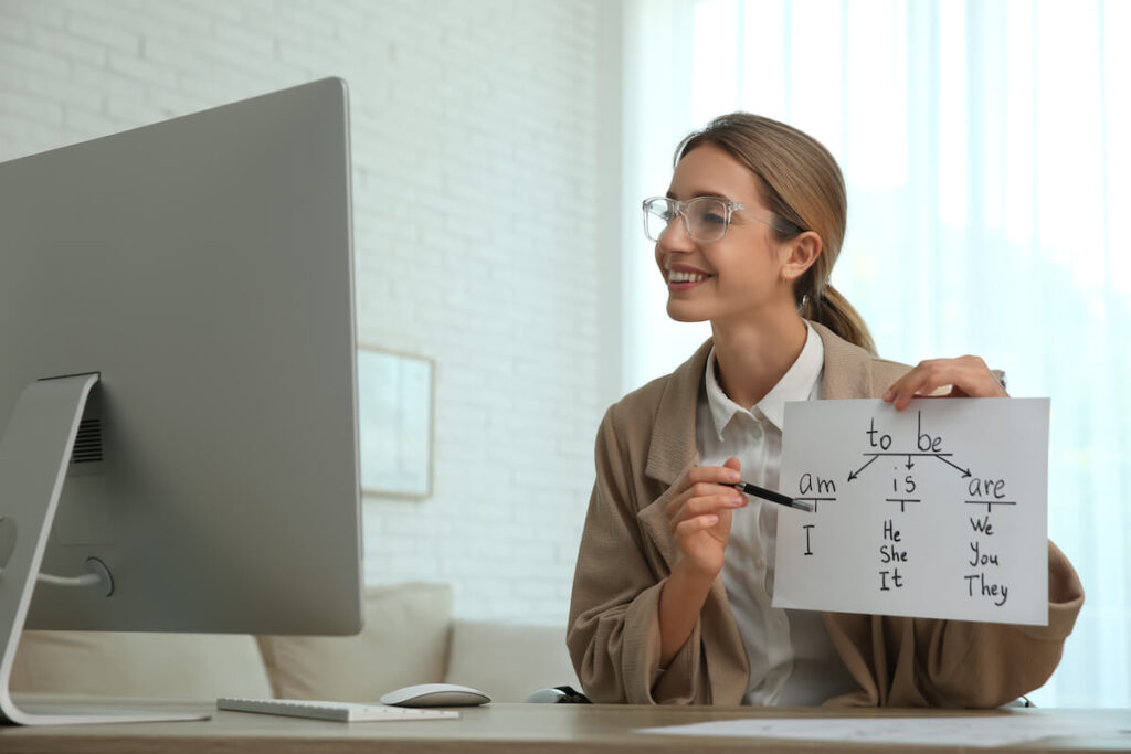 Teacher giving online lesson on English grammar