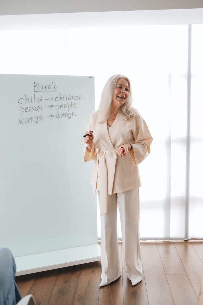 teacher teaching English plurals