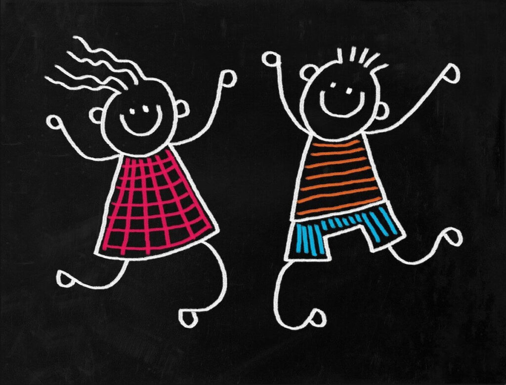 Chalk art of two jumping kids