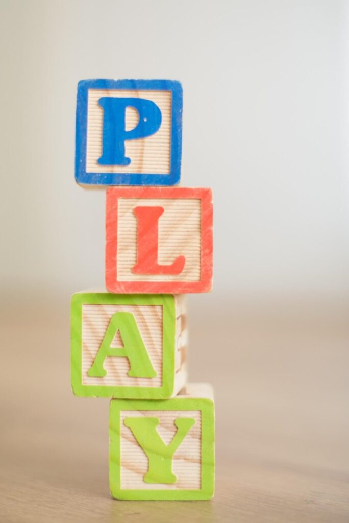 Blocks make up the word “play”