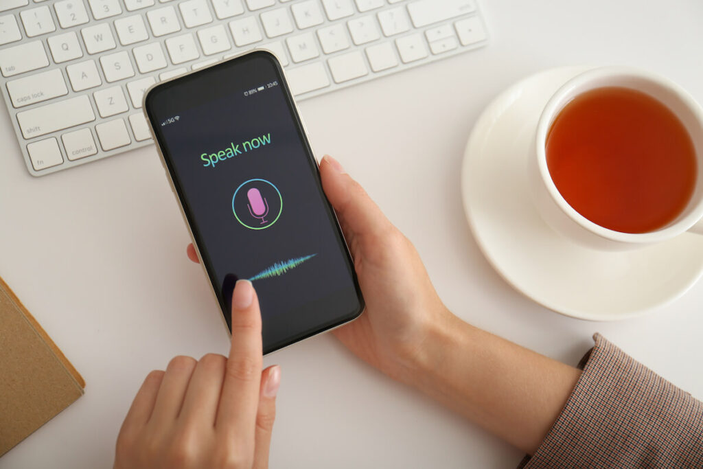 hand holding Korean speaking app