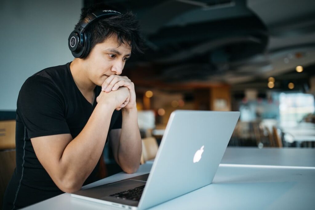 young man focusing on computer