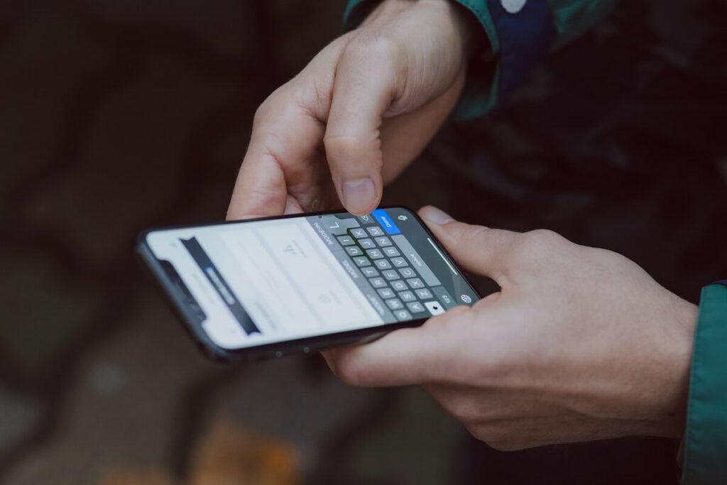 Man typing on phone