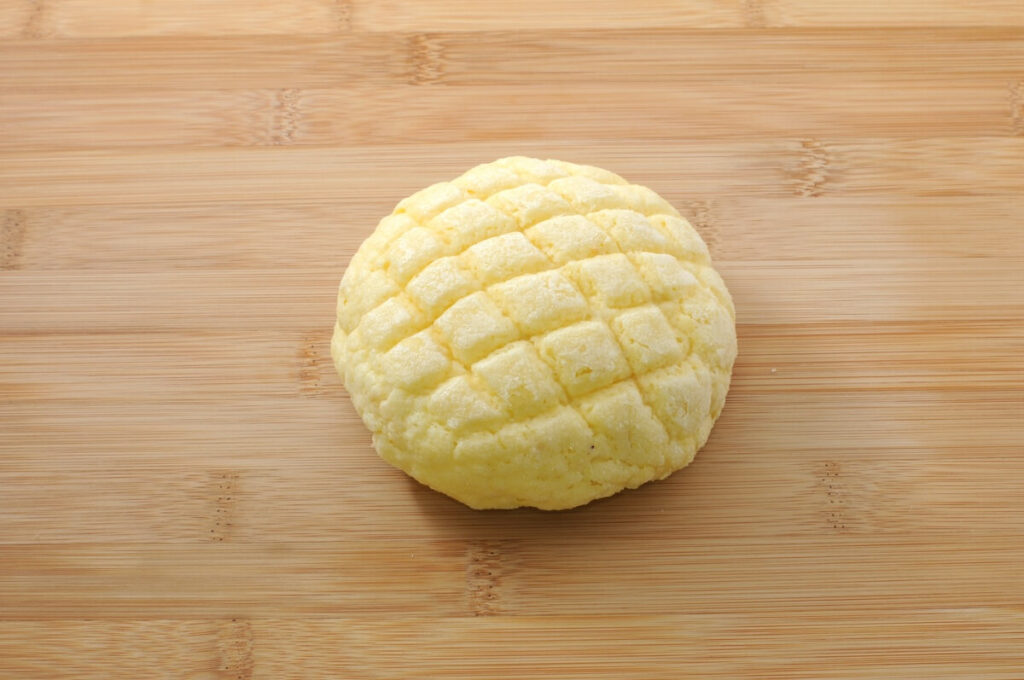 Japanese bread called melon pan on cutting board