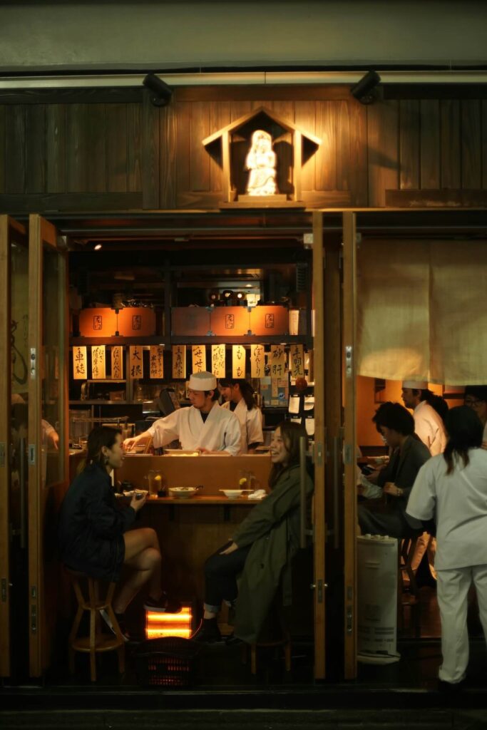 Two women hanging out in a Japanese izakaya