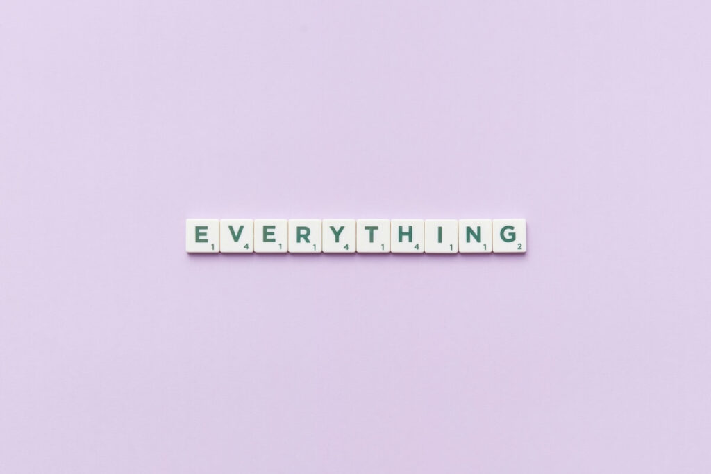 scrabble tiles spelling out the word "everything"