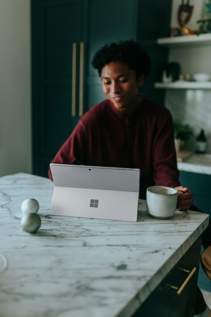 man using a Surface laptop