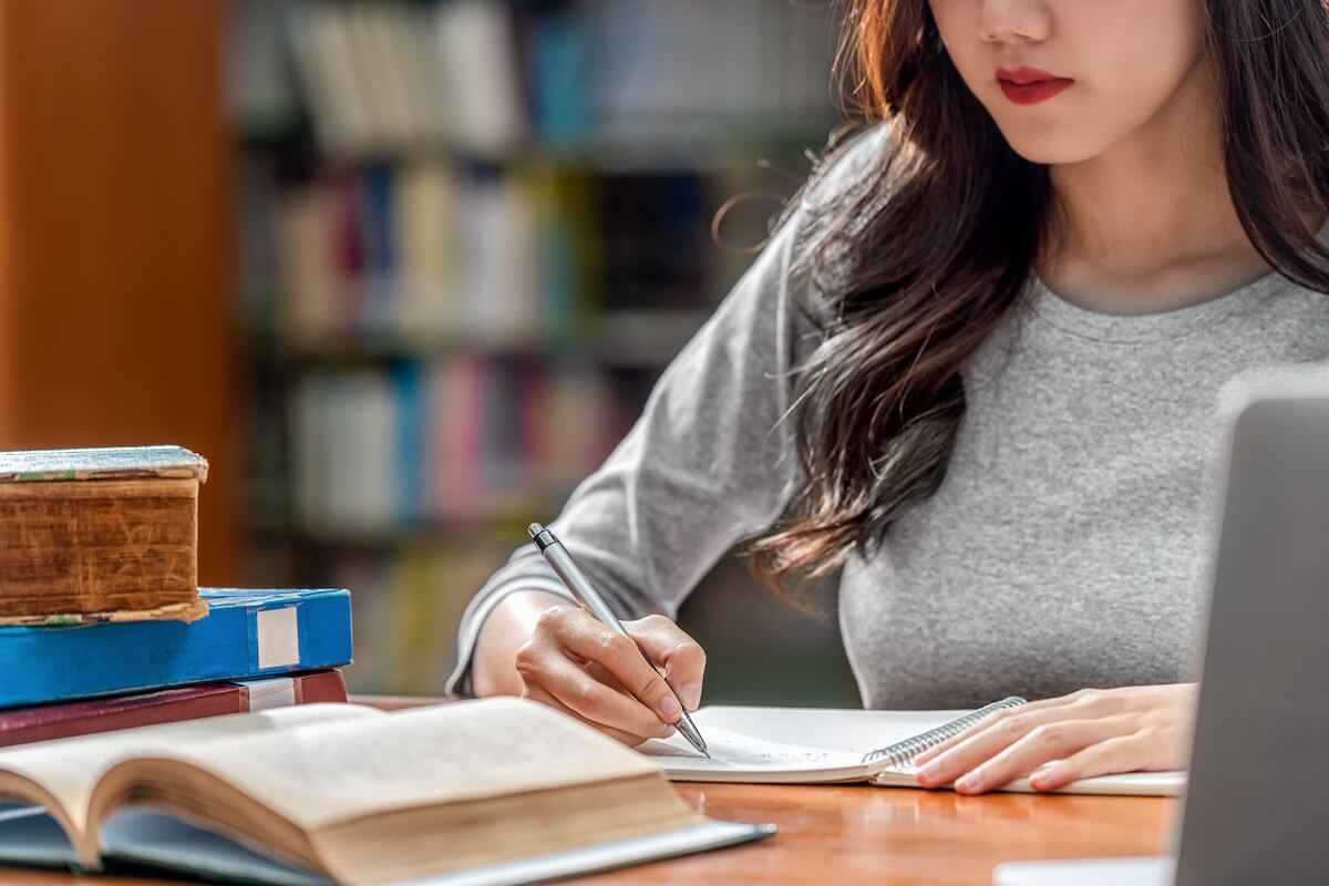 student studying with book