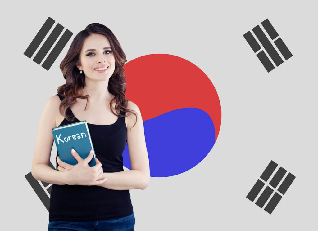 woman holding a Korean book with Korean flag in the background
