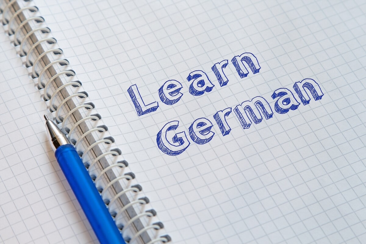 "Learn German" written on grid-lined page of notebook
