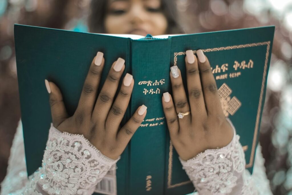 bride holding an Amharic Bible