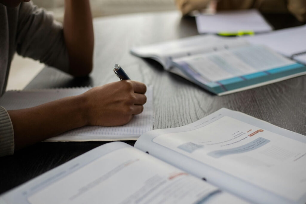 person studying with a workbook