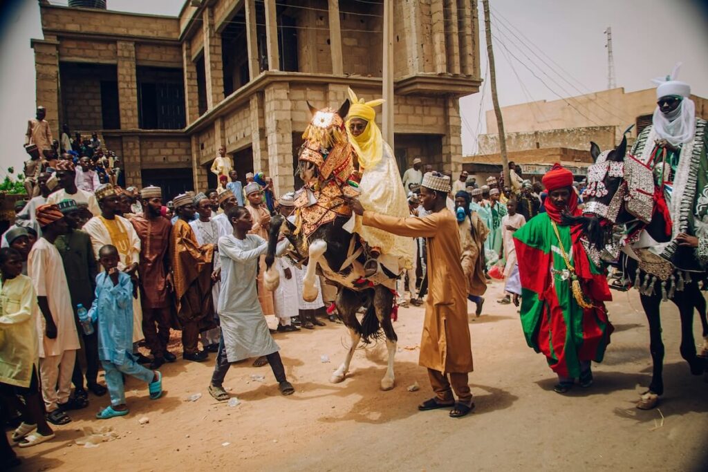 crowd around horse in a festival in Nigeria