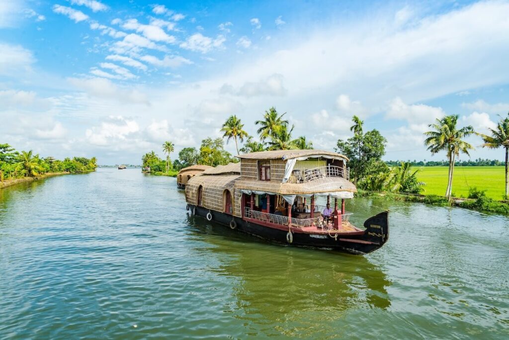 boat floating over the Alapphuzha backwaters in Kerala, India