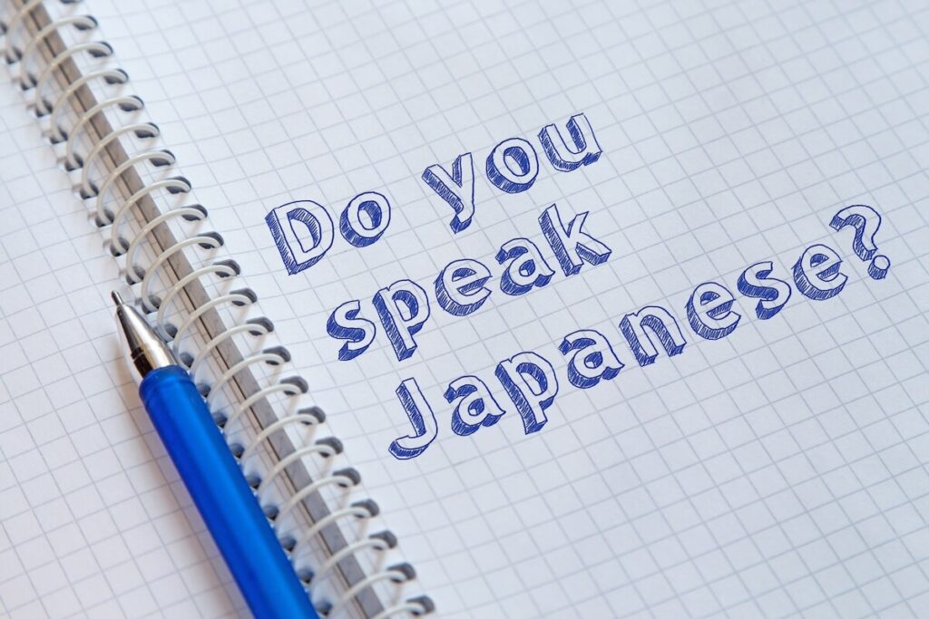 notebook with "Do you speak Japanese?" written on it