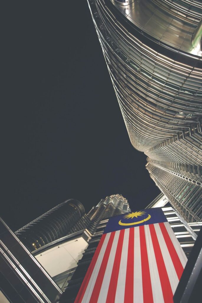 Malaysian flag hanging below Petronas Towers