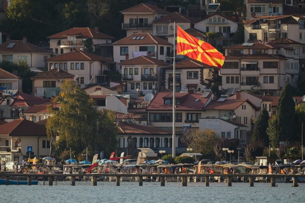 Macedonian flag over harbor in Ohrid, North Macedonia