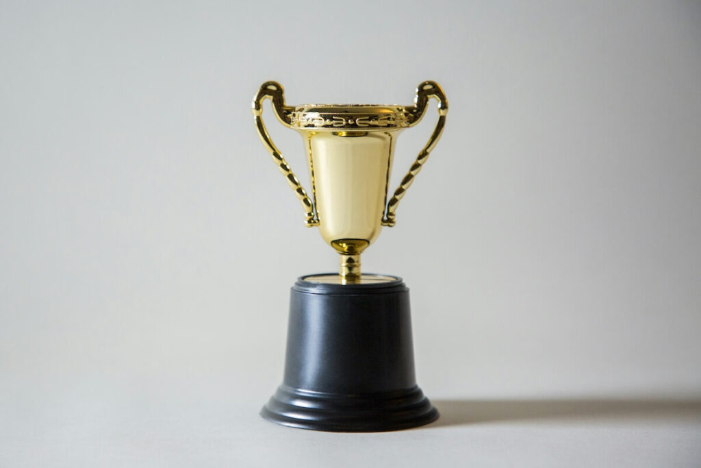 gold trophy with plain background