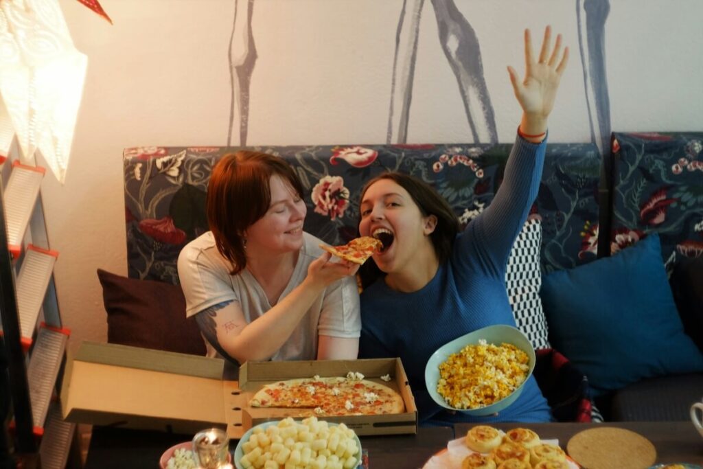 two women eating and having fun