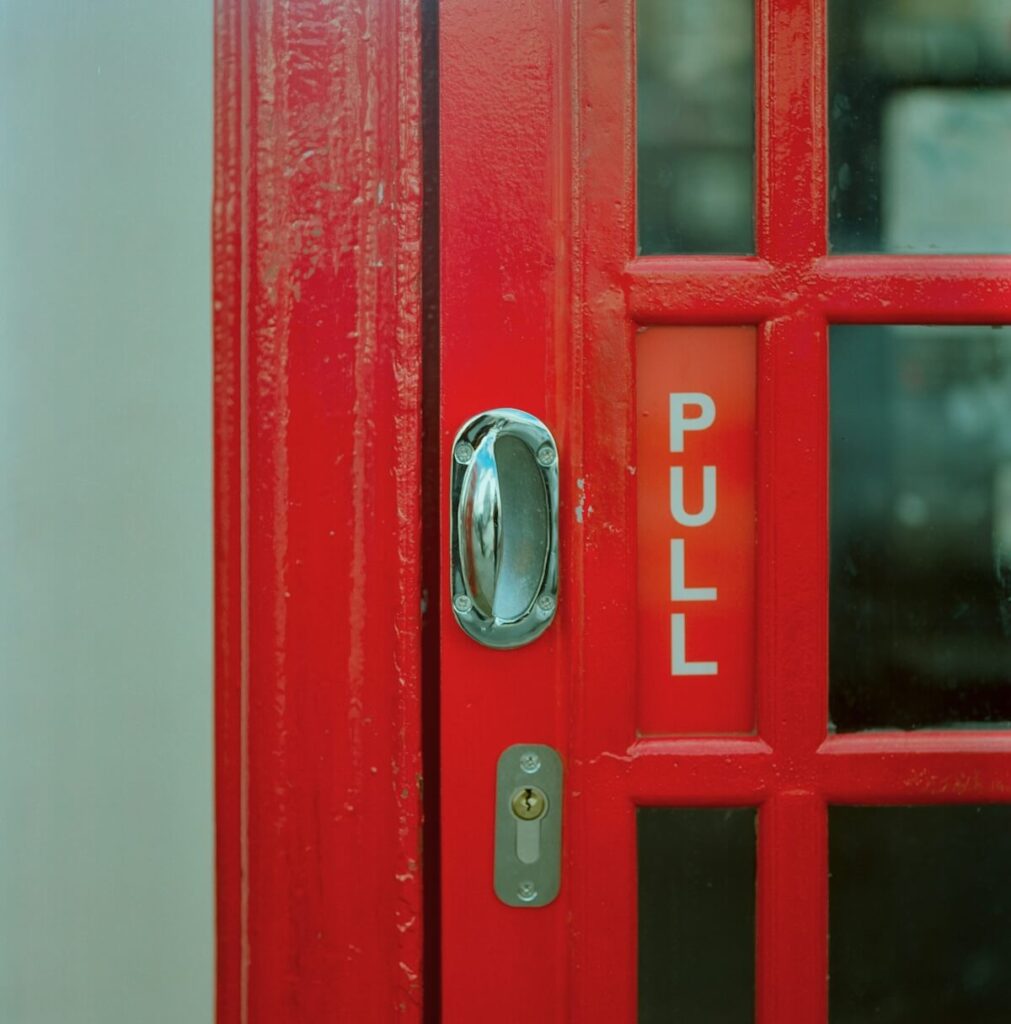 red door with "pull" sign