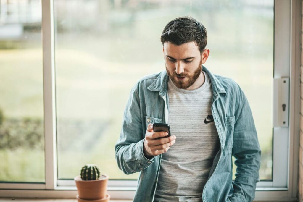 man using his mobile phone