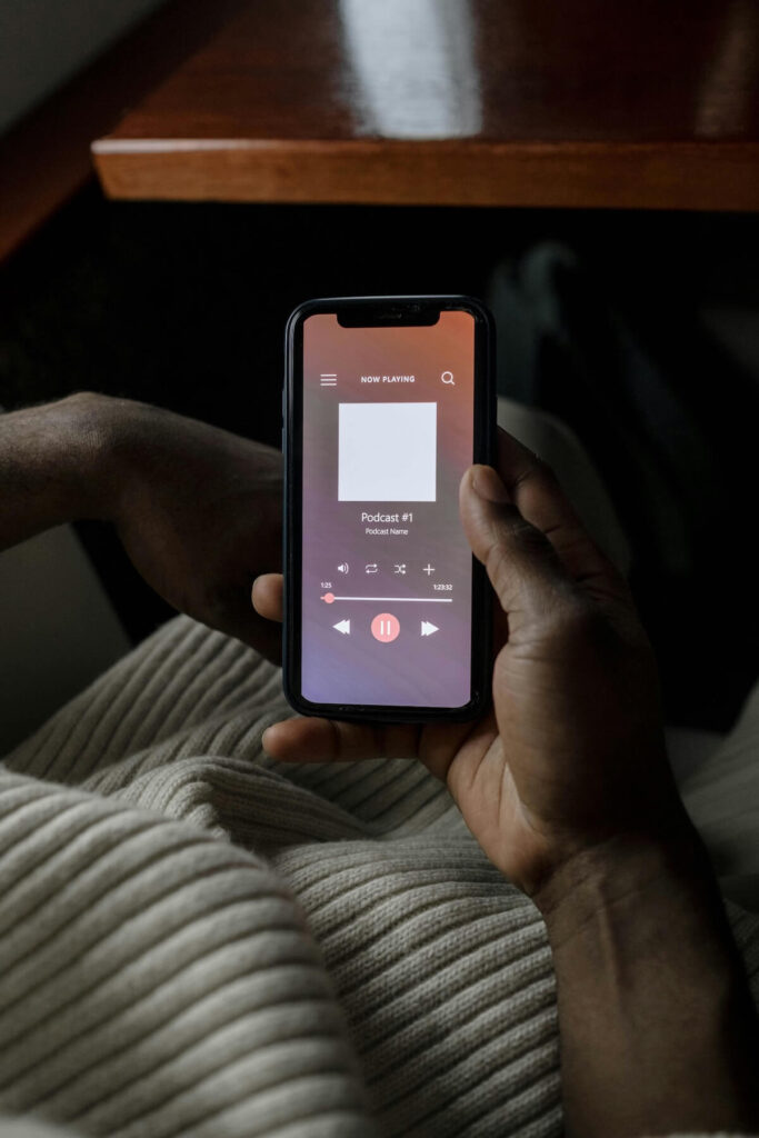 person listening to podcast on phone