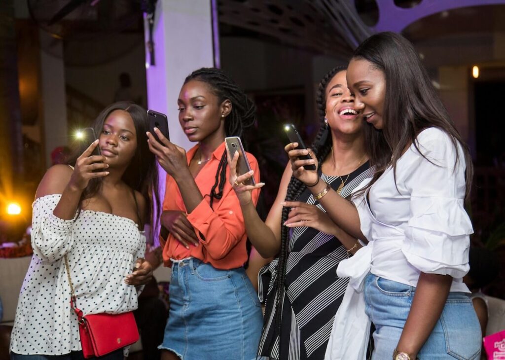 girls watching on phones