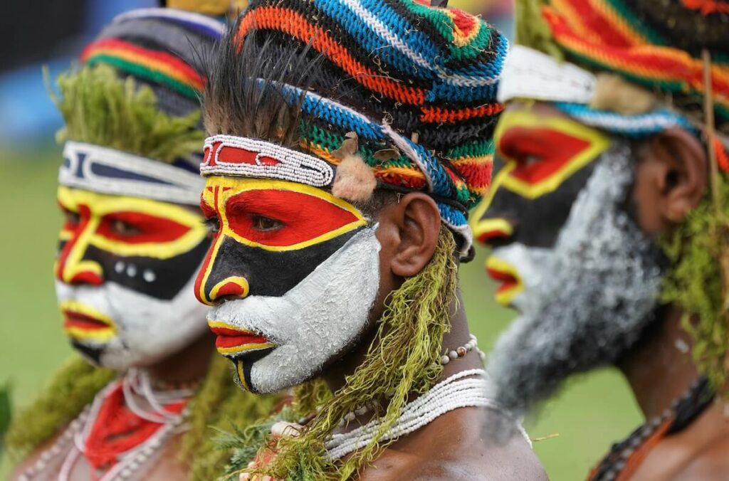 men in tribal makeup in Papua New Guinea