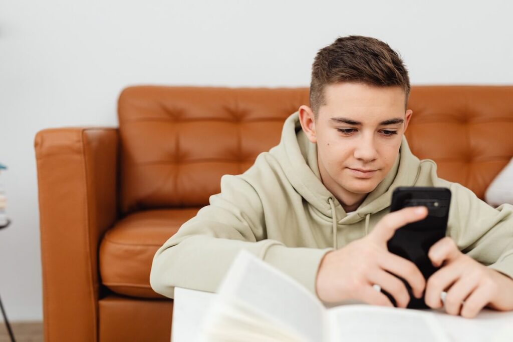 man studying with phone